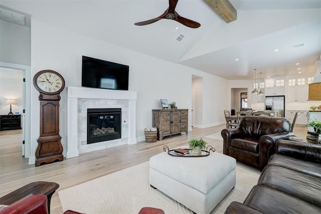 living room with light wood-style flooring, visible vents, recessed lighting, beamed ceiling, and ceiling fan