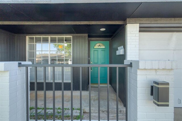 entrance to property with concrete block siding