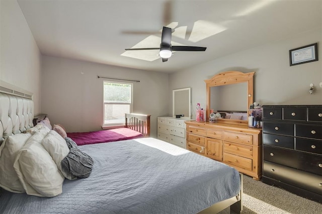 bedroom featuring ceiling fan and carpet floors