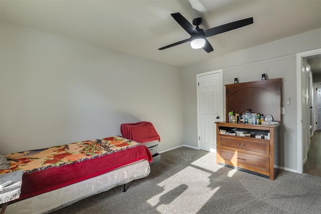 bedroom featuring baseboards, a ceiling fan, and carpet floors