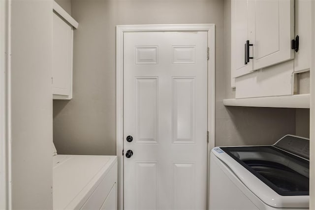 laundry area with cabinet space and washer / clothes dryer