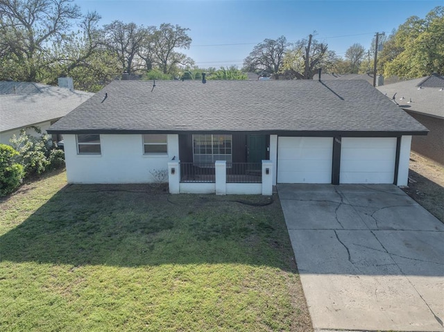 ranch-style home featuring a porch, a front lawn, an attached garage, a shingled roof, and driveway