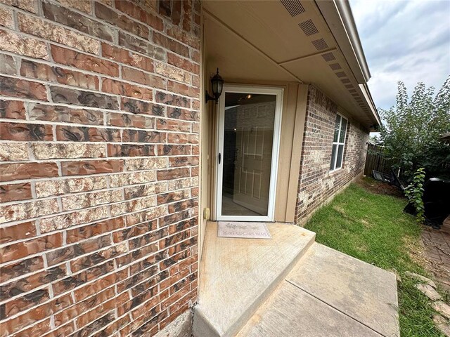 12308 SW 9th Ter, Yukon, OK 73099 - property entrance featuring brick siding