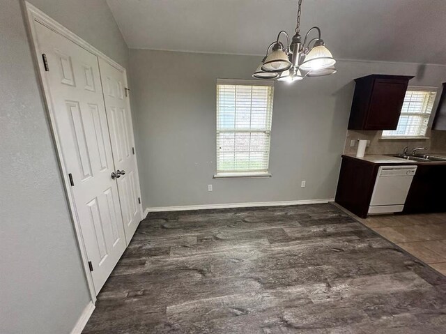 12308 SW 9th Ter, Yukon, OK 73099 - kitchen featuring white dishwasher, a chandelier, a sink, wood finished floors, and dark brown cabinetry