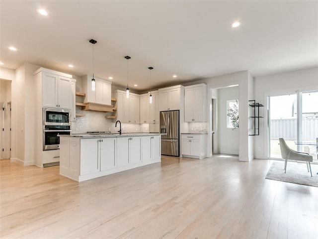 3532 Paso Robles Ter, Edmond, OK 73034 - kitchen featuring light wood-style flooring, white cabinetry, backsplash, open shelves, and appliances with stainless steel finishes