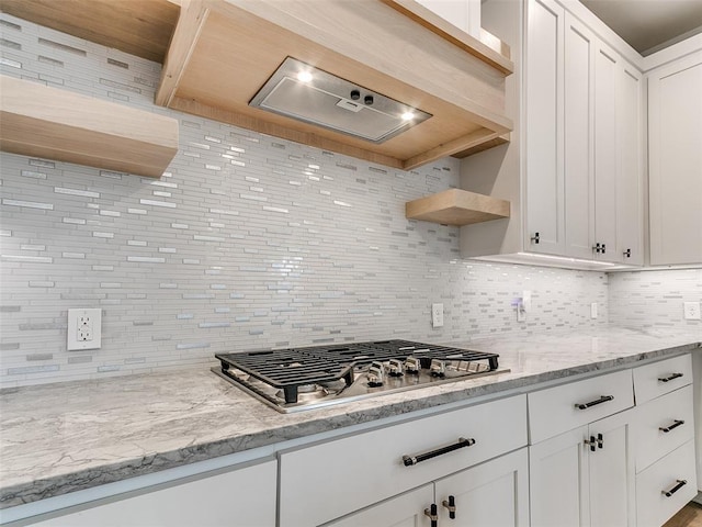 3532 Paso Robles Ter, Edmond, OK 73034 - kitchen with white cabinetry, stainless steel gas cooktop, open shelves, and decorative backsplash
