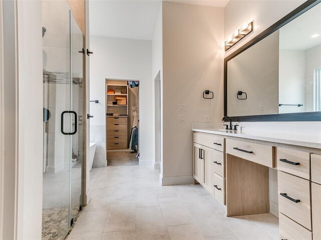3532 Paso Robles Ter, Edmond, OK 73034 - bathroom featuring vanity, baseboards, a spacious closet, tile patterned floors, and a shower stall
