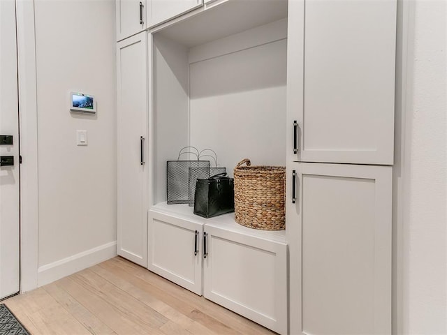 3532 Paso Robles Ter, Edmond, OK 73034 - interior space with light wood-style floors, light countertops, and white cabinetry