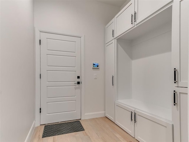 3532 Paso Robles Ter, Edmond, OK 73034 - mudroom with light wood-style flooring and baseboards