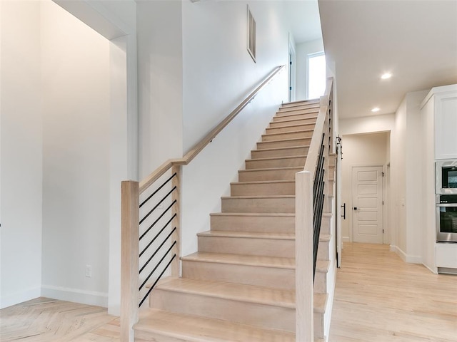 3532 Paso Robles Ter, Edmond, OK 73034 - stairway with parquet flooring, recessed lighting, visible vents, and baseboards