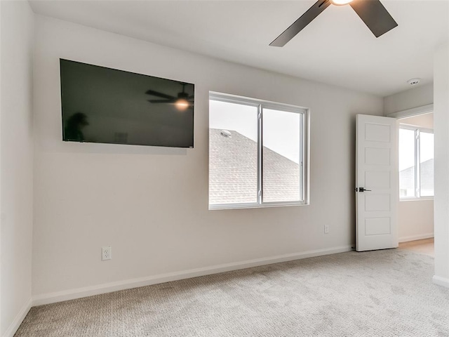 3532 Paso Robles Ter, Edmond, OK 73034 - empty room with carpet floors, a wealth of natural light, a ceiling fan, and baseboards