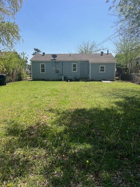 3741 SW 43rd St, Oklahoma City, OK 73119 - back of property featuring a yard and central AC unit