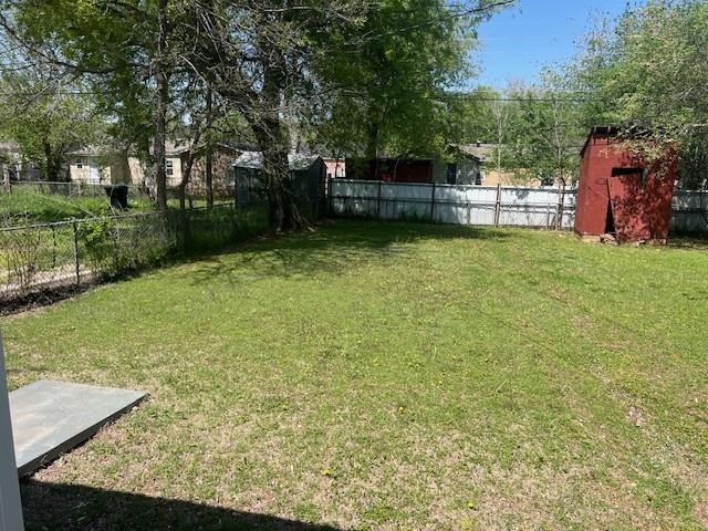 3741 SW 43rd St, Oklahoma City, OK 73119 - view of yard with an outbuilding and a fenced backyard
