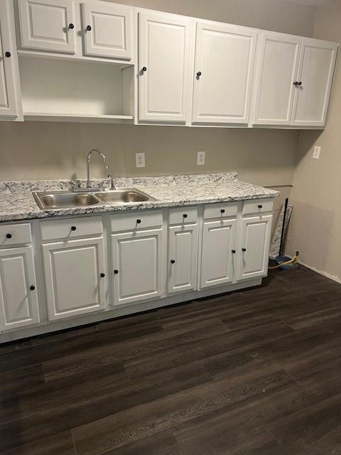 3741 SW 43rd St, Oklahoma City, OK 73119 - kitchen featuring a sink and white cabinets
