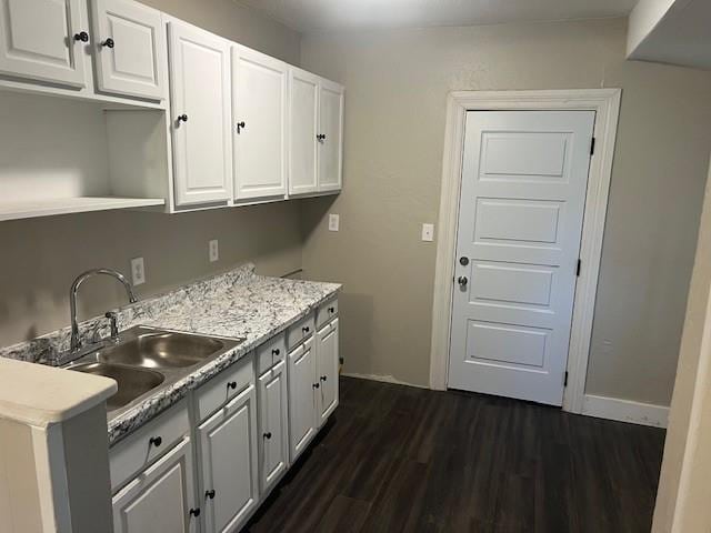 3741 SW 43rd St, Oklahoma City, OK 73119 - laundry room with dark wood-style flooring and a sink