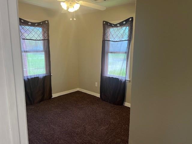 3741 SW 43rd St, Oklahoma City, OK 73119 - unfurnished room featuring ceiling fan, dark colored carpet, and baseboards