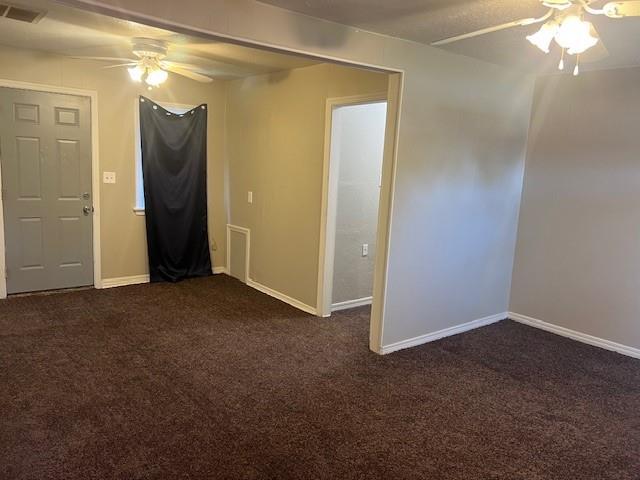 3741 SW 43rd St, Oklahoma City, OK 73119 - unfurnished room with visible vents, ceiling fan, dark colored carpet, and baseboards