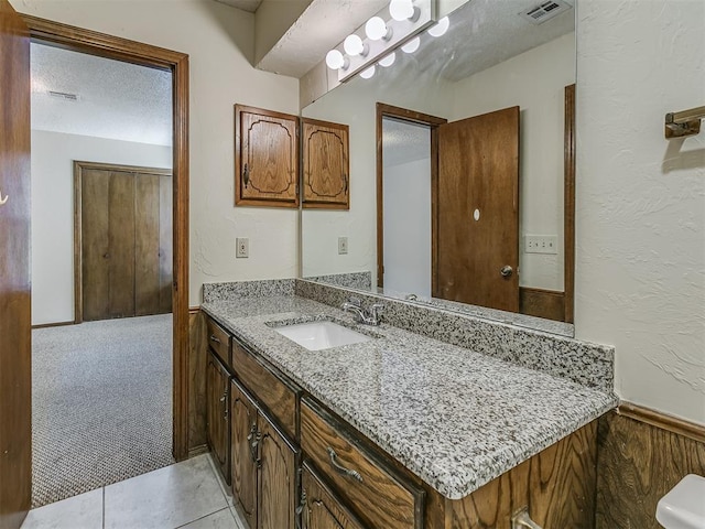bathroom with vanity and visible vents