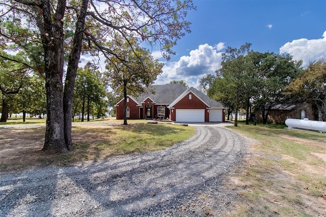 428532 E 1150th Rd, Porum, OK 74455 - view of front facade featuring a front yard, an attached garage, and driveway