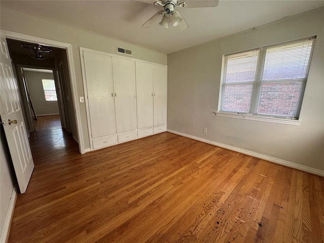 4445 NW 19th St, Oklahoma City, OK 73107 - unfurnished bedroom with visible vents, light wood-style flooring, and baseboards