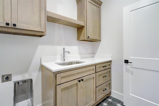 101 Pont Neuf Ct, Edmond, OK 73034 - clothes washing area with baseboards, a sink, cabinet space, and electric dryer hookup