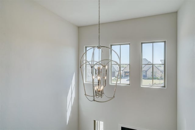 101 Pont Neuf Ct, Edmond, OK 73034 - interior details with an inviting chandelier