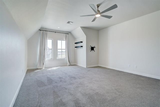 101 Pont Neuf Ct, Edmond, OK 73034 - additional living space featuring a ceiling fan, visible vents, vaulted ceiling, carpet floors, and baseboards