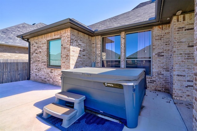 101 Pont Neuf Ct, Edmond, OK 73034 - view of patio with fence and a hot tub