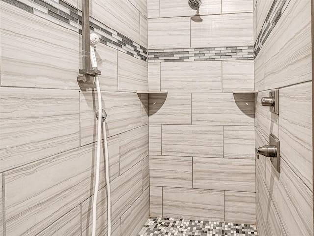 full bathroom with tiled shower