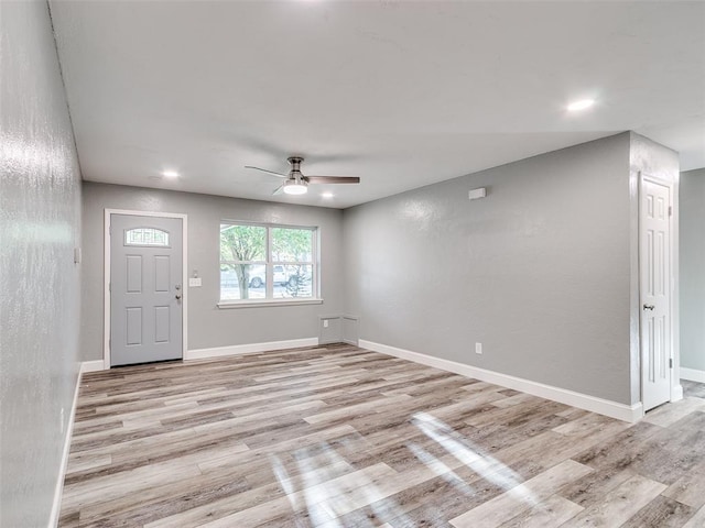 unfurnished living room featuring light wood-style flooring, recessed lighting, ceiling fan, and baseboards