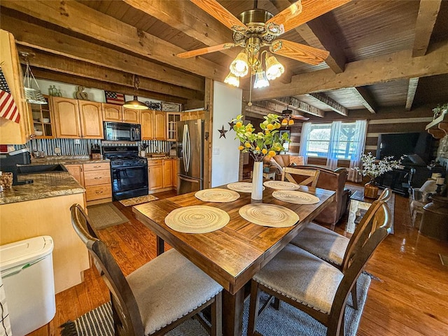 31230 N County Road 3170, Elmore City, OK 73433 - dining room featuring wood ceiling, a ceiling fan, wood finished floors, and beam ceiling