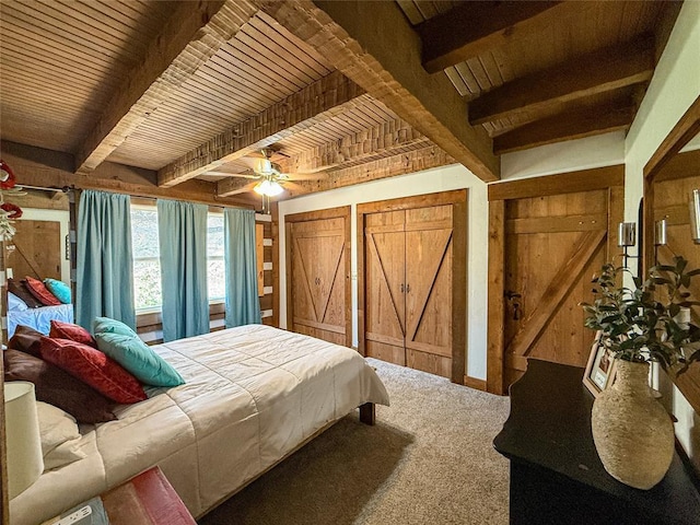 31230 N County Road 3170, Elmore City, OK 73433 - bedroom featuring wood ceiling, carpet flooring, beam ceiling, and two closets