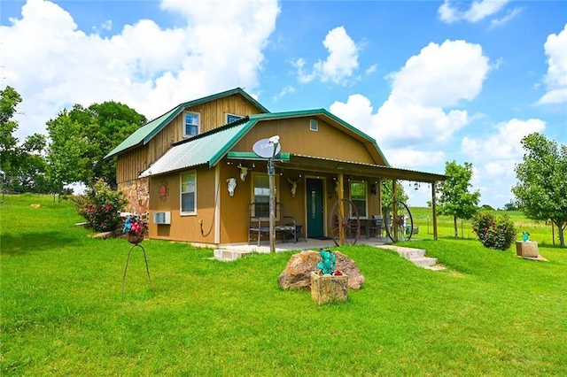 31230 N County Road 3170, Elmore City, OK 73433 - rear view of property featuring a patio area, a yard, and stucco siding