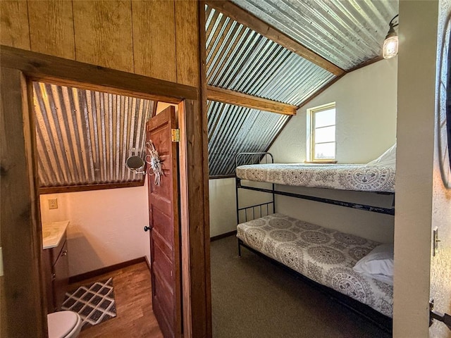 31230 N County Road 3170, Elmore City, OK 73433 - bedroom with wood finished floors, vaulted ceiling, and baseboards