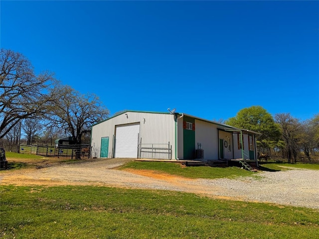 31230 N County Road 3170, Elmore City, OK 73433 - view of outbuilding with an outdoor structure, fence, and dirt driveway