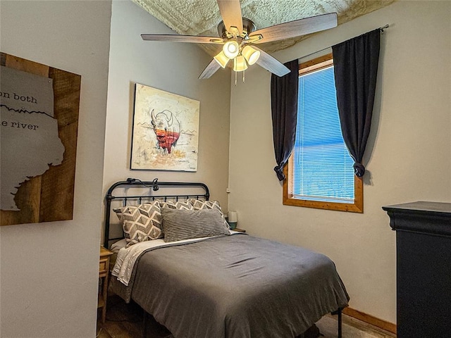 31230 N County Road 3170, Elmore City, OK 73433 - bedroom featuring a ceiling fan and baseboards
