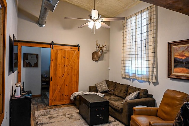 31230 N County Road 3170, Elmore City, OK 73433 - living area featuring a barn door, wood finished floors, and ceiling fan