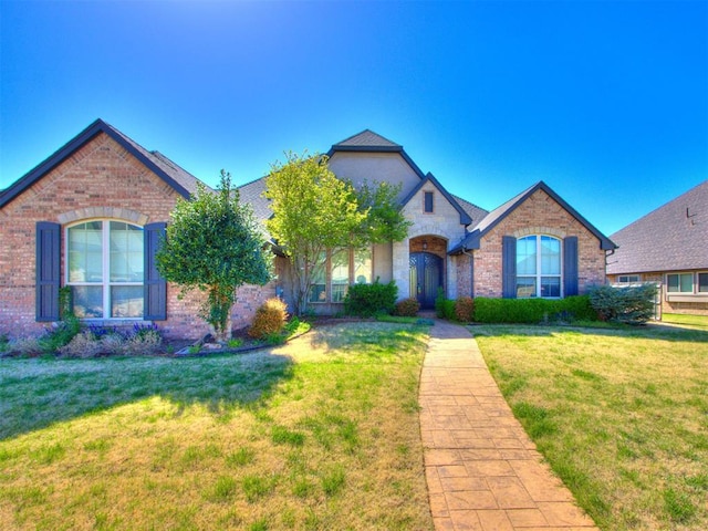 15213 Wilford Way, Edmond, OK 73013 - ranch-style house featuring brick siding and a front yard