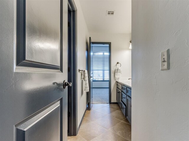 15213 Wilford Way, Edmond, OK 73013 - bathroom featuring visible vents, tile patterned floors, and vanity