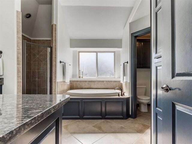 15213 Wilford Way, Edmond, OK 73013 - bathroom with a shower stall, a garden tub, tile patterned flooring, and toilet