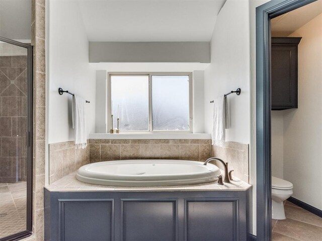 15213 Wilford Way, Edmond, OK 73013 - full bath featuring a shower stall, a bath, tile patterned flooring, and toilet