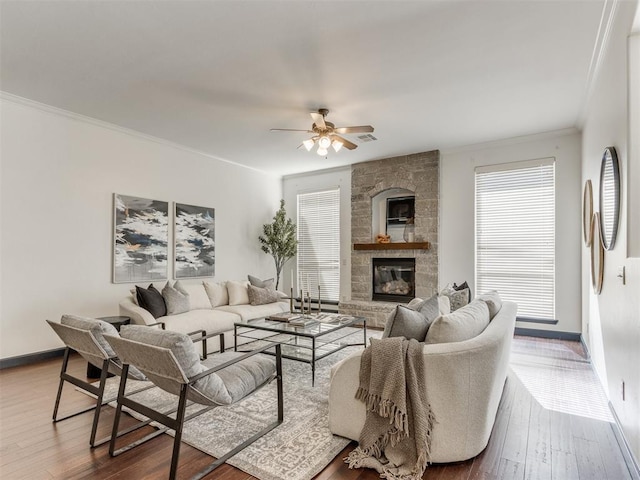 15213 Wilford Way, Edmond, OK 73013 - living room with hardwood / wood-style flooring, a stone fireplace, ornamental molding, and ceiling fan