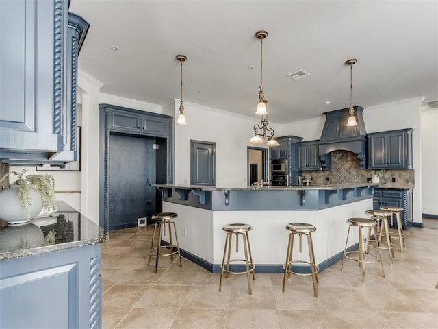 15213 Wilford Way, Edmond, OK 73013 - kitchen with visible vents, ornamental molding, appliances with stainless steel finishes, a kitchen bar, and backsplash