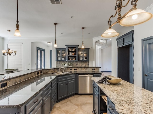 15213 Wilford Way, Edmond, OK 73013 - kitchen with glass insert cabinets, visible vents, dishwasher, a sink, and backsplash
