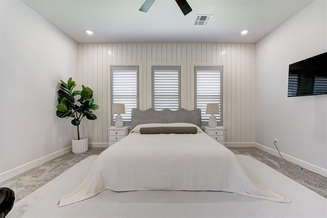 carpeted bedroom with ceiling fan, baseboards, visible vents, and recessed lighting