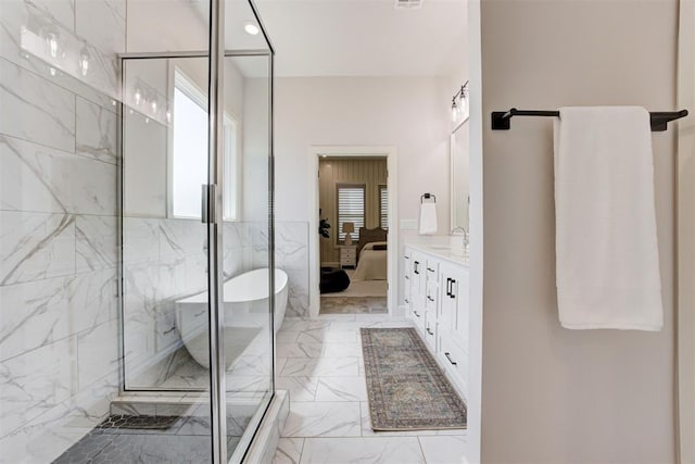 ensuite bathroom with vanity, connected bathroom, a marble finish shower, visible vents, and marble finish floor