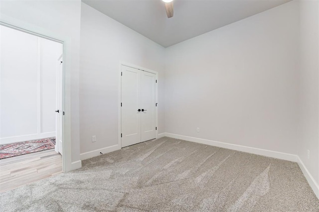 unfurnished bedroom with baseboards, a ceiling fan, and carpet flooring