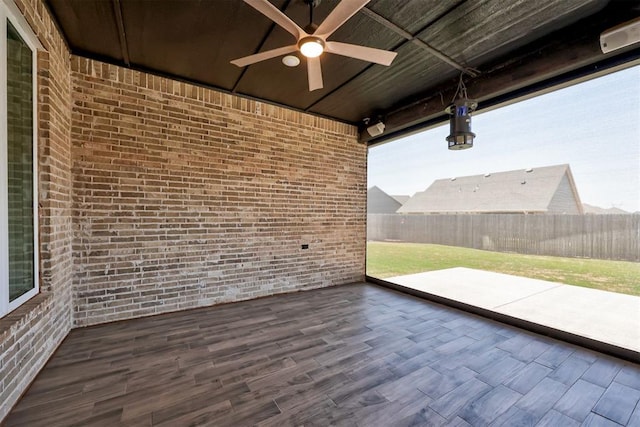 view of patio with fence and ceiling fan