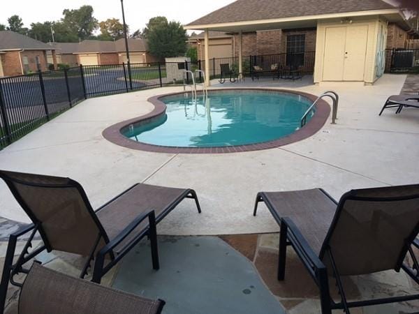 4408 32nd Pl, Oklahoma City, OK 73112 - community pool featuring fence and a patio