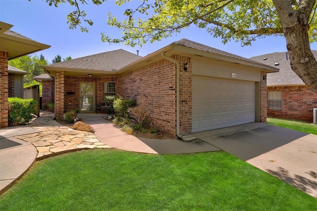 4408 32nd Pl, Oklahoma City, OK 73112 - ranch-style house featuring roof with shingles, driveway, an attached garage, a front lawn, and brick siding